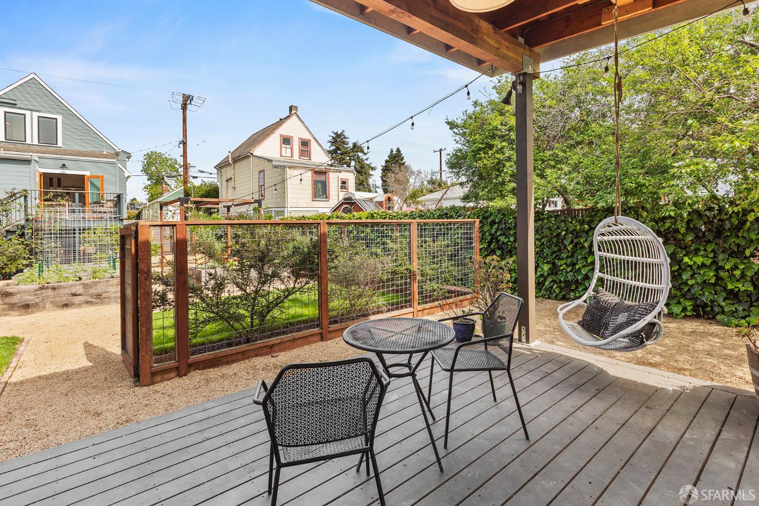 1610 Oregon Street Berkeley, CA 94703 - Photo 39 of 68 a view of a chairs and table in patio with wooden fence