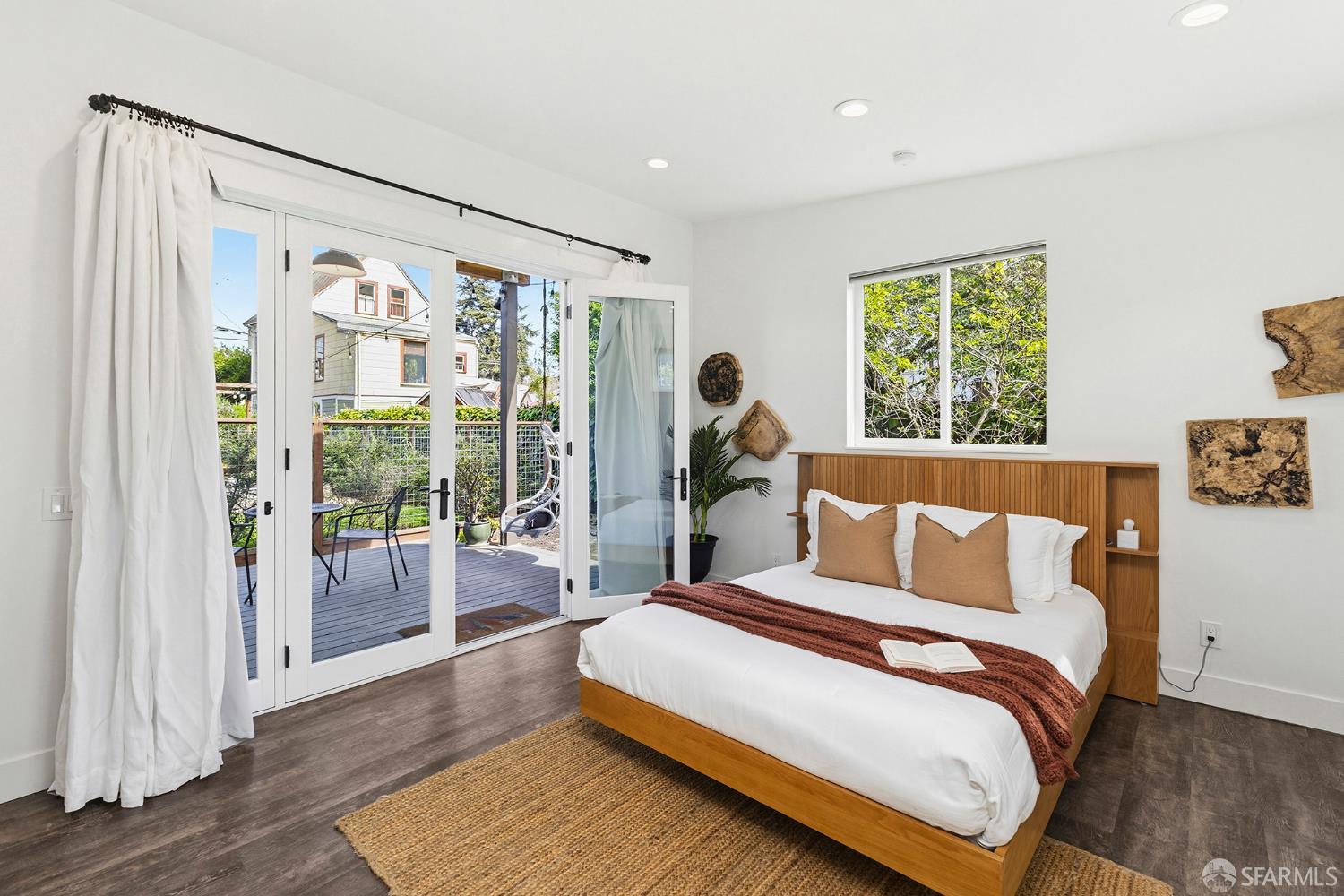 1610 Oregon Street Berkeley, CA 94703 - Photo 41 of 68 a bedroom with a large bed and a large window