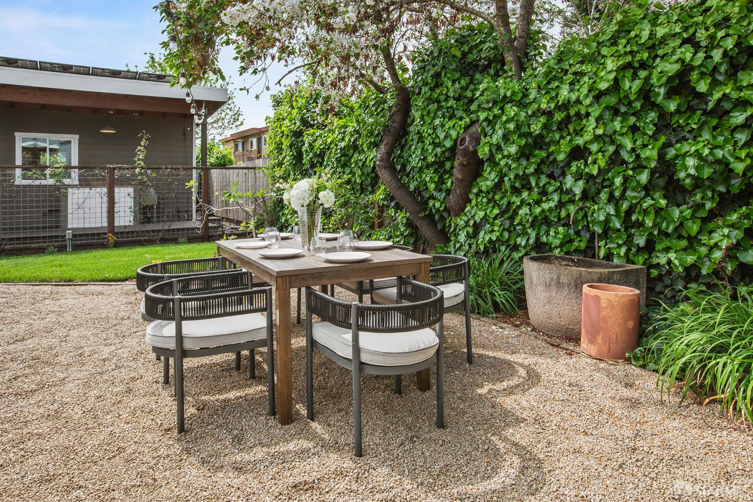 1610 Oregon Street Berkeley, CA 94703 - Photo 50 of 68 a table and chairs in a patio
