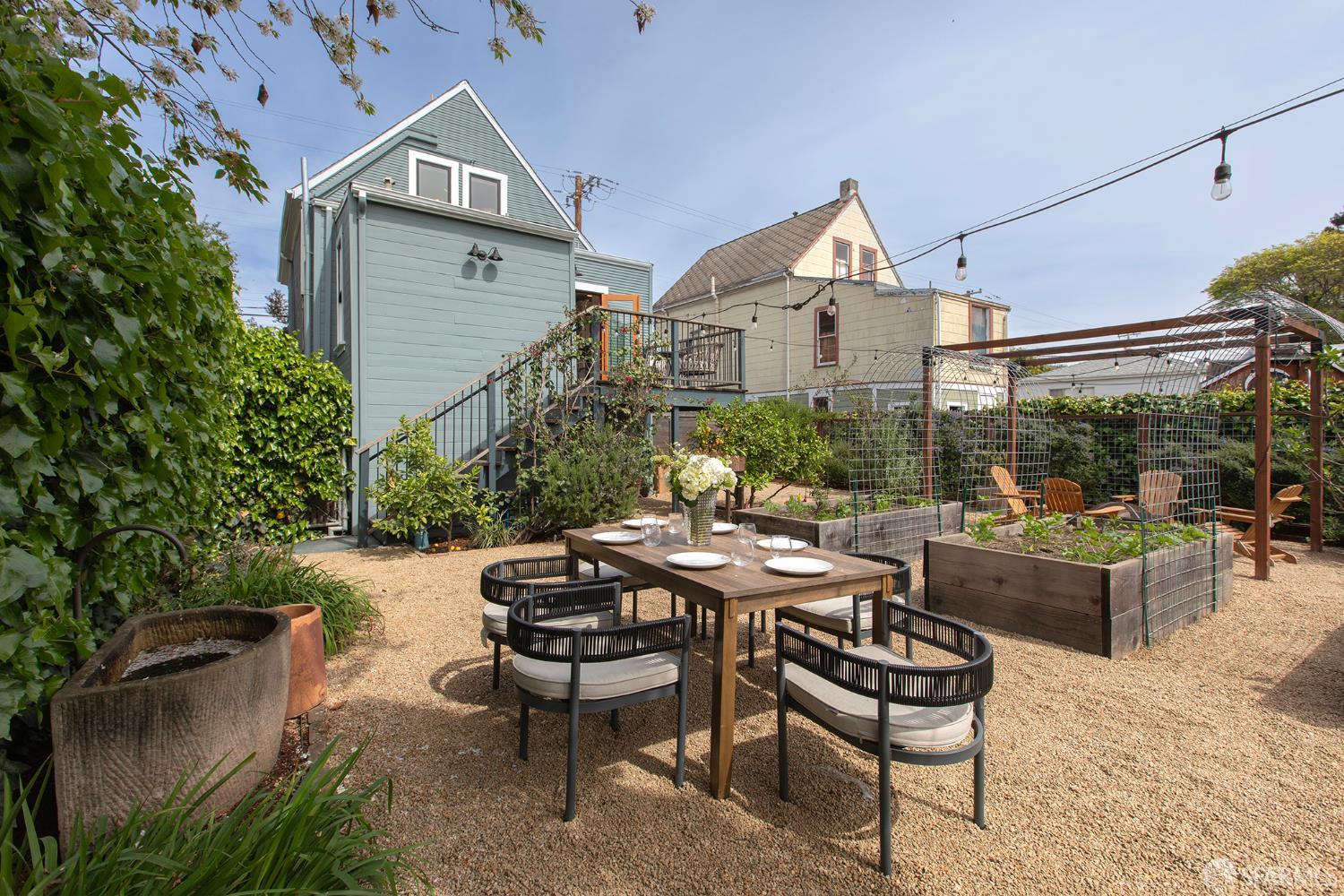 1610 Oregon Street Berkeley, CA 94703 - Photo 54 of 68 a view of a patio with couches table and chairs and potted plants
