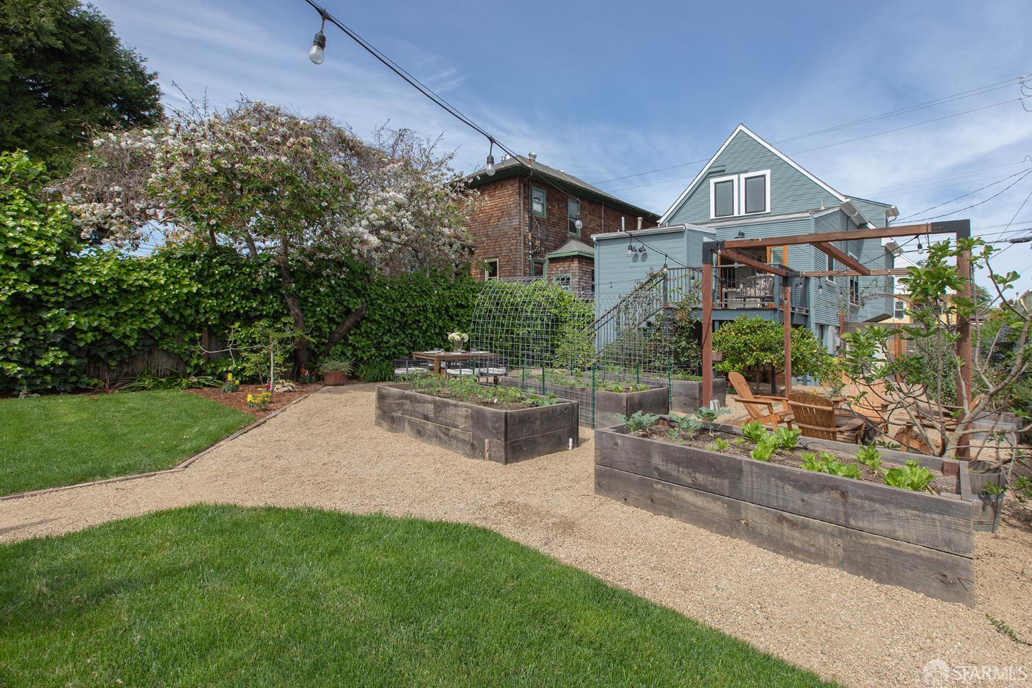 1610 Oregon Street Berkeley, CA 94703 - Photo 55 of 68 a front view of a house with a garden and plants