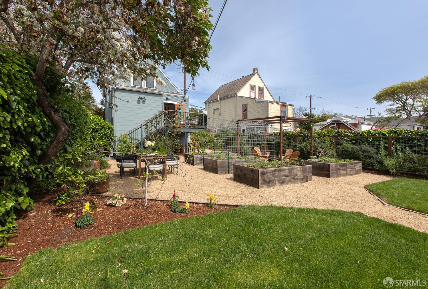 1610 Oregon Street Berkeley, CA 94703 - Photo 56 of 68 a view of a house with patio and a garden