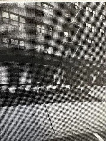 a kitchen with stainless steel appliances granite countertop a sink a stove and chairs