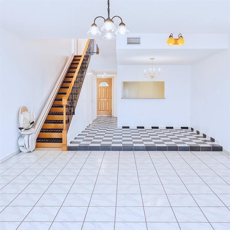 824 West 41st Street, Unit 52 Hialeah, FL 33012 - Photo 1 of 17 a view of an empty room with wooden floor
