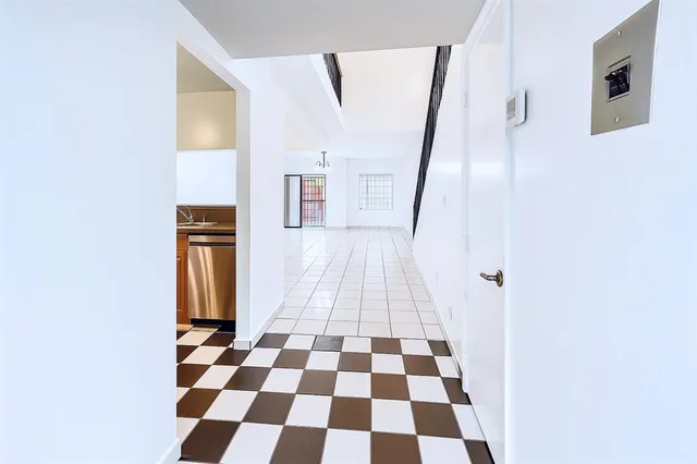 a view of a storage & utility room with a window