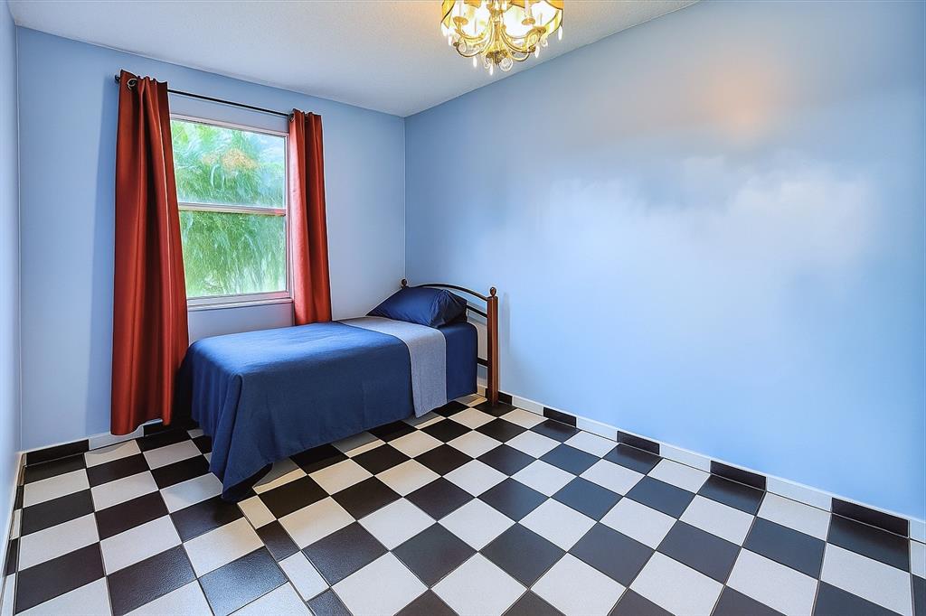 824 West 41st Street, Unit 52 Hialeah, FL 33012 - Photo 7 of 17 a bedroom with a bed and a window