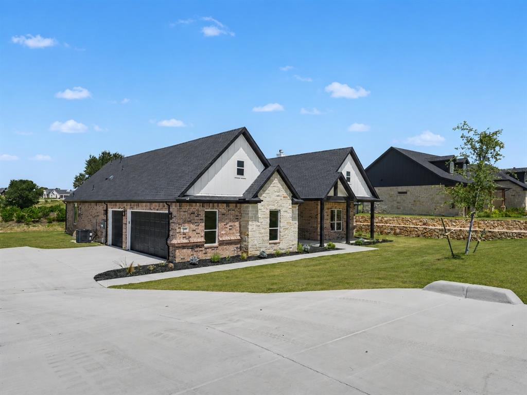 328 Slimp Bluff Azle, TX 76020 - Photo 3 of 30 Contemporary single-story residence featuring a combination brick and stone facade