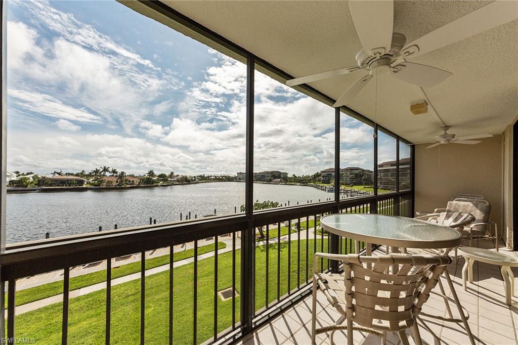 591 Seaview Court, Unit A306 Marco Island, FL 34145 - Photo 13 of 16 a view of a balcony with furniture
