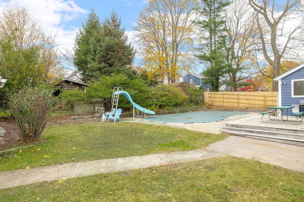 51 Denmark Avenue Milton, MA 02186 - Photo 15 of 18 a view of a garden with a slide