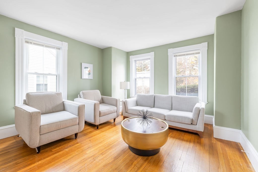 51 Denmark Avenue Milton, MA 02186 - Photo 2 of 18 a living room with furniture and a large window