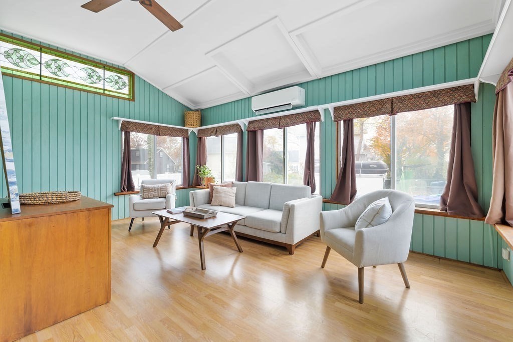 51 Denmark Avenue Milton, MA 02186 - Photo 6 of 18 a living room with furniture and a large window