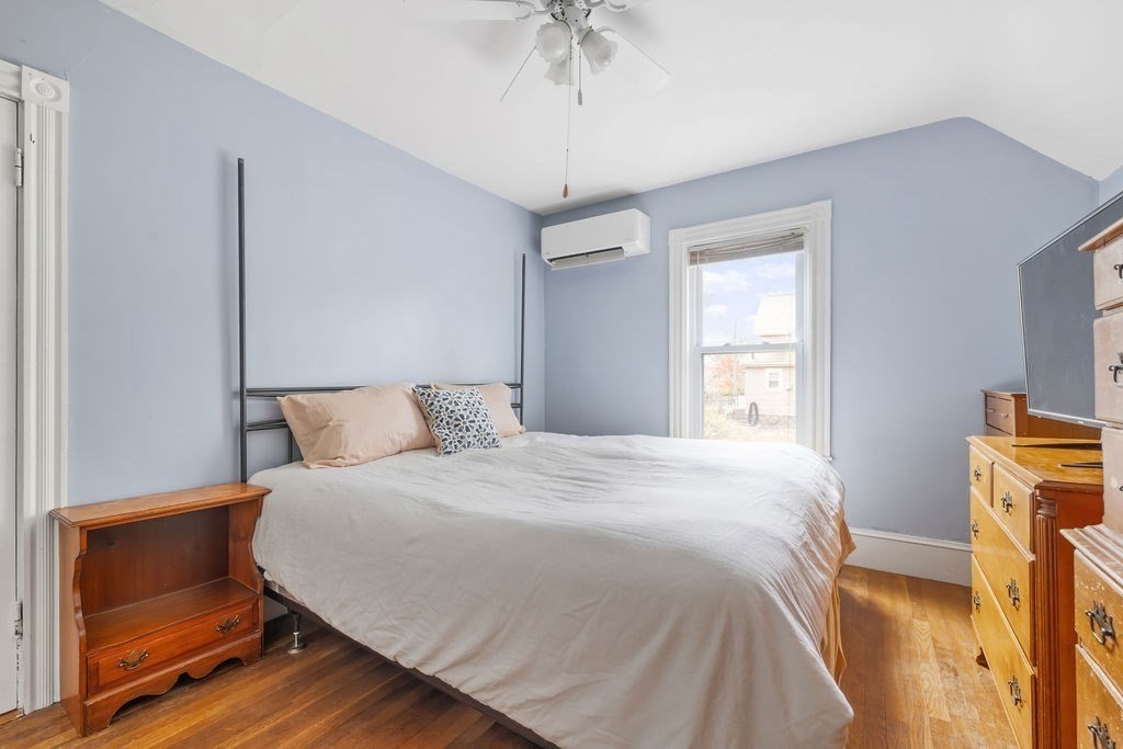 51 Denmark Avenue Milton, MA 02186 - Photo 10 of 18 a bedroom with a bed and a dresser