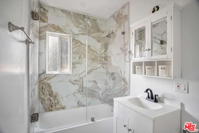 a bathroom with a bathtub and a sink