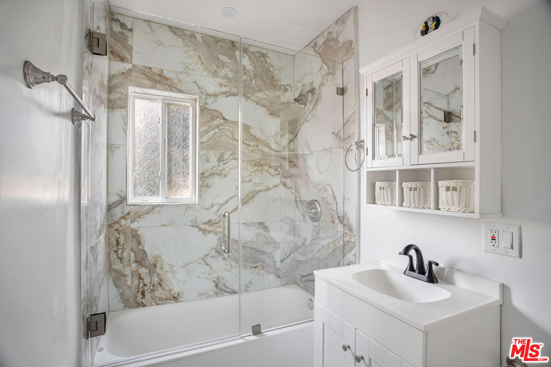 1844 18th Street, Unit A Santa Monica, CA 90404 - Photo 5 of 11 a bathroom with a bathtub and a sink