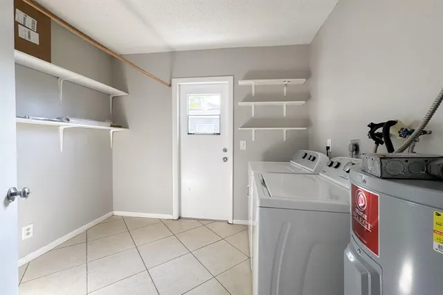 a utility room with dryer and washer