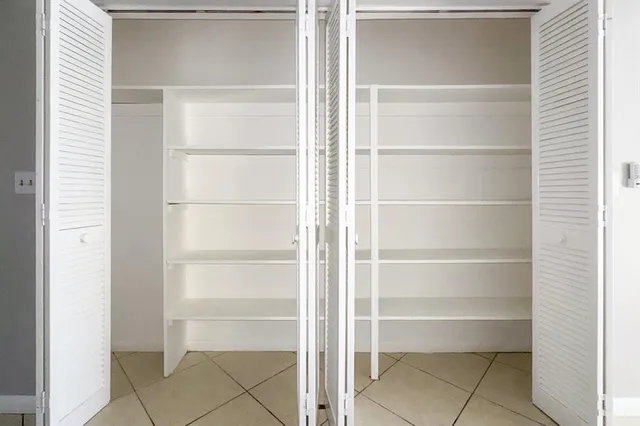 a view of an empty walk in closet