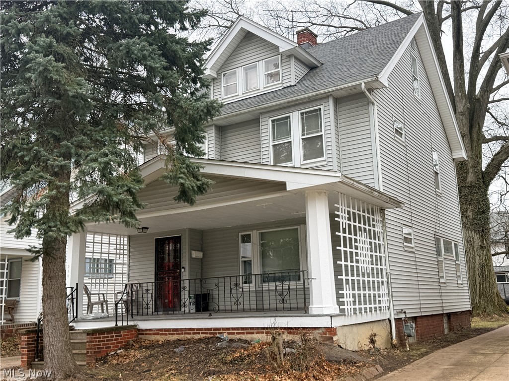 980 Brunswick Road Cleveland Heights, OH 44112 - Photo 1 of 11 American foursquare style home featuring covered porch, a chimney, and a shingled roof