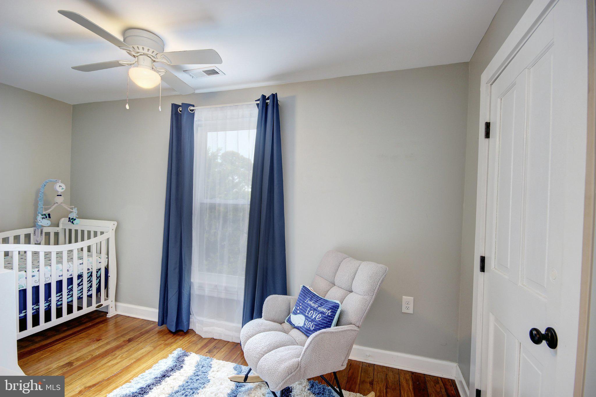 803 Market Street Denton, MD 21629 - Photo 20 of 27 Serene nursery with calming hues.