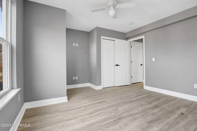 a bathroom with a shower a toilet and sink