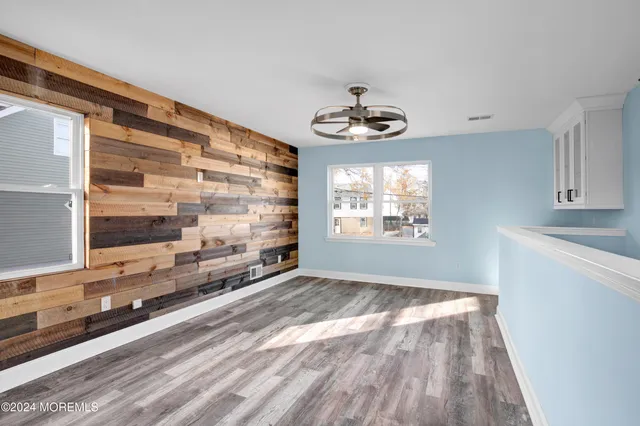 a view of an empty room and a window