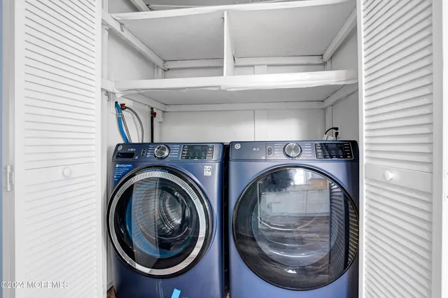 a bathroom with a sink a toilet and a window