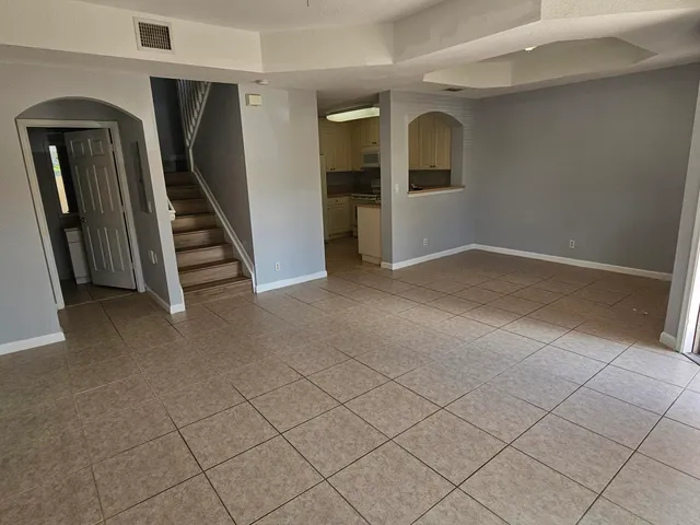 an empty room with staircase