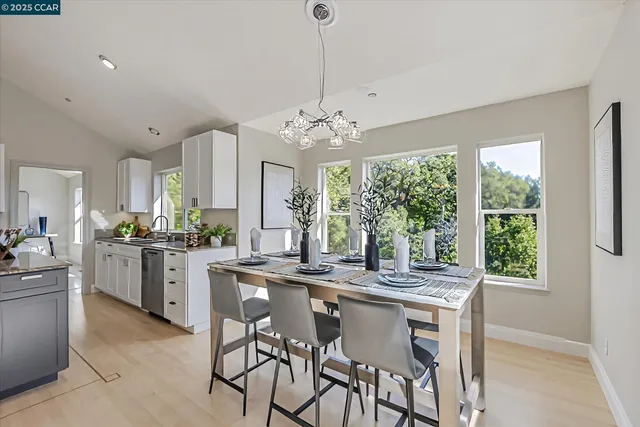 a kitchen with center island and windows