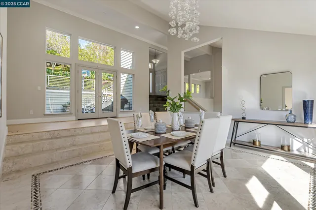 a dining room with furniture and window