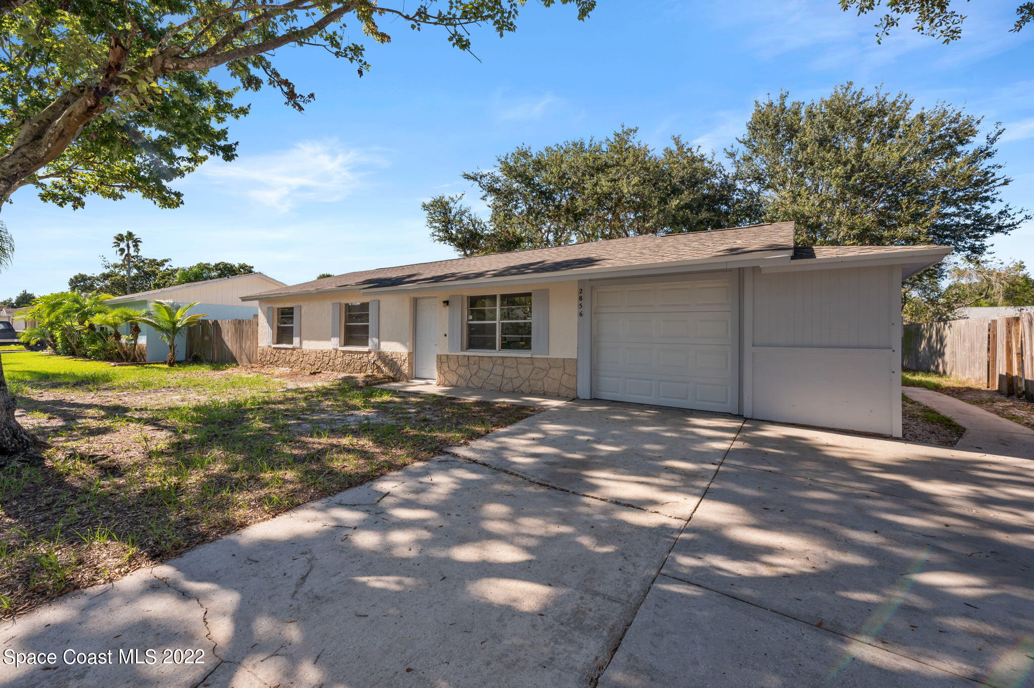 2856 Lancaster Road Melbourne, FL 32935 - Photo 1 of 22 a view of a house with a yard