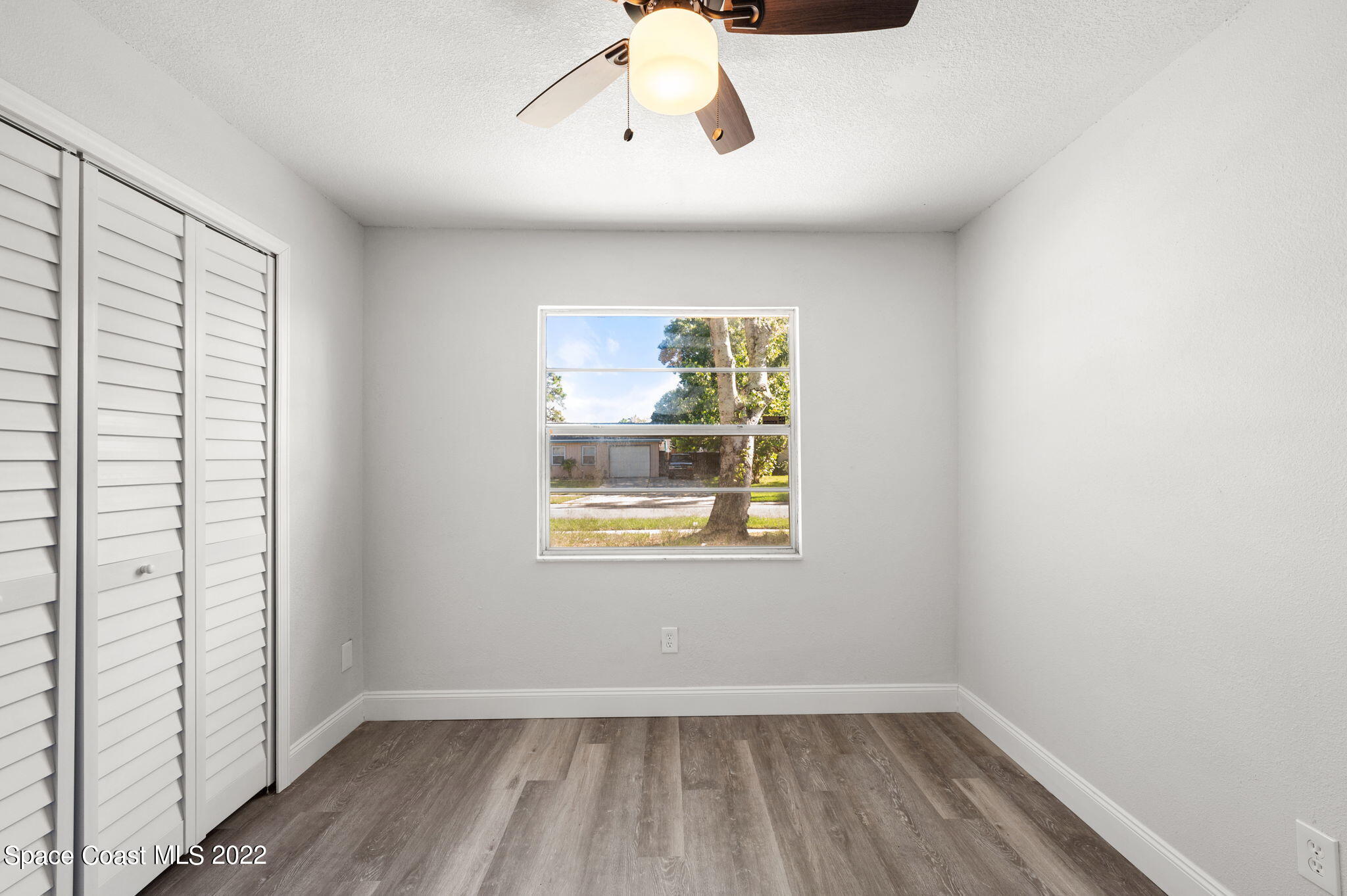 2856 Lancaster Road Melbourne, FL 32935 - Photo 14 of 22 a view of an empty room with a window