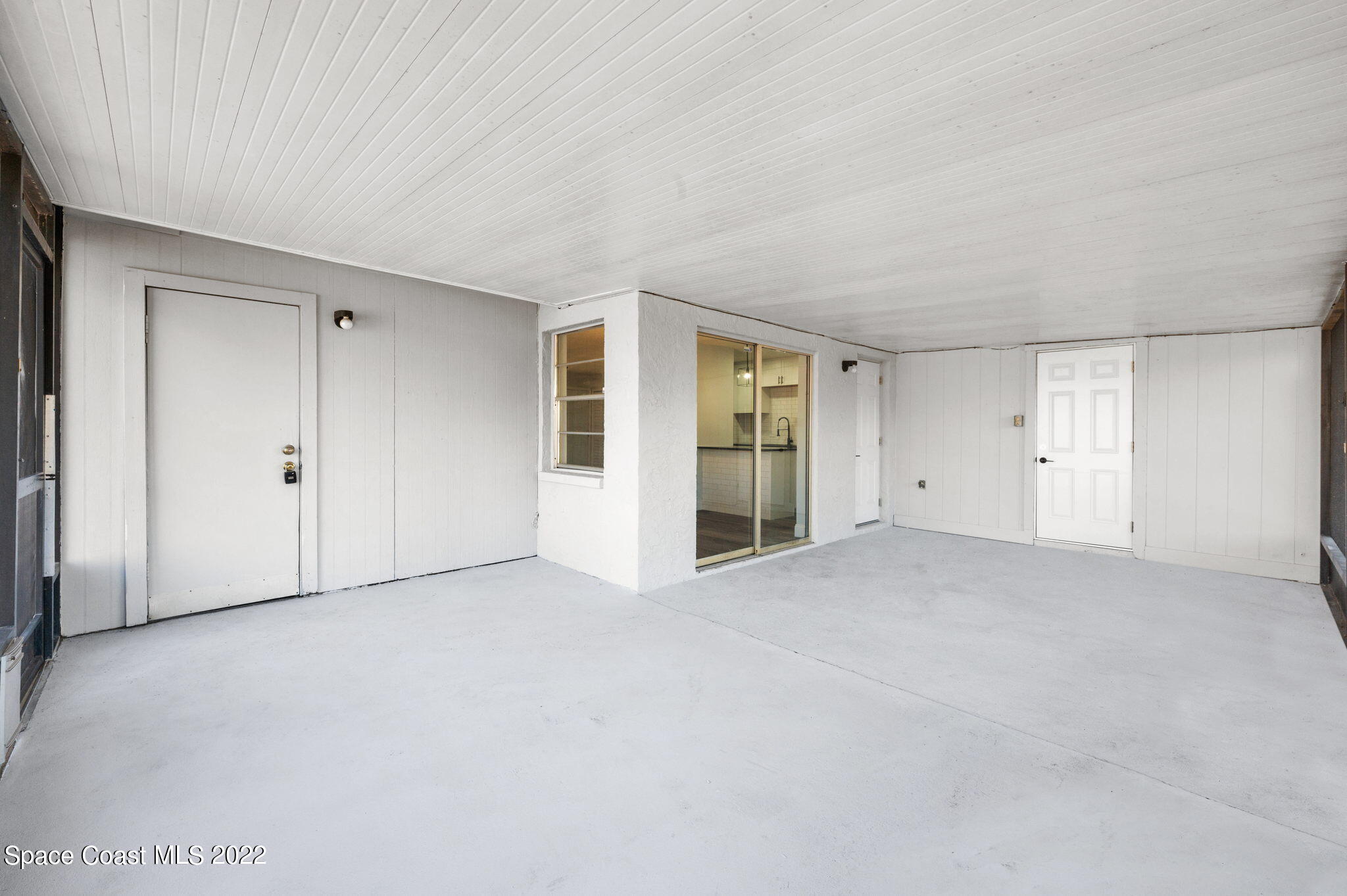 2856 Lancaster Road Melbourne, FL 32935 - Photo 18 of 22 a view of an empty room with a window