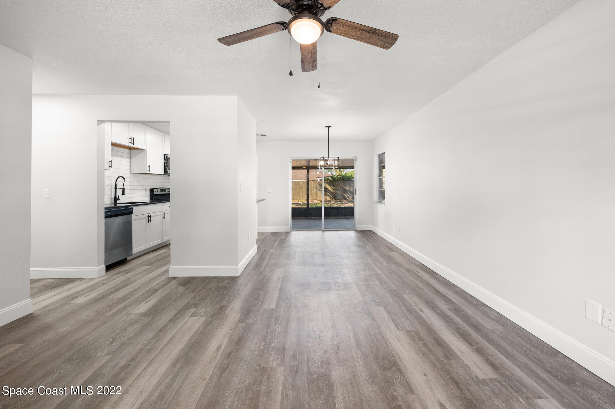 2856 Lancaster Road Melbourne, FL 32935 - Photo 4 of 22 a view of empty room with wooden floor