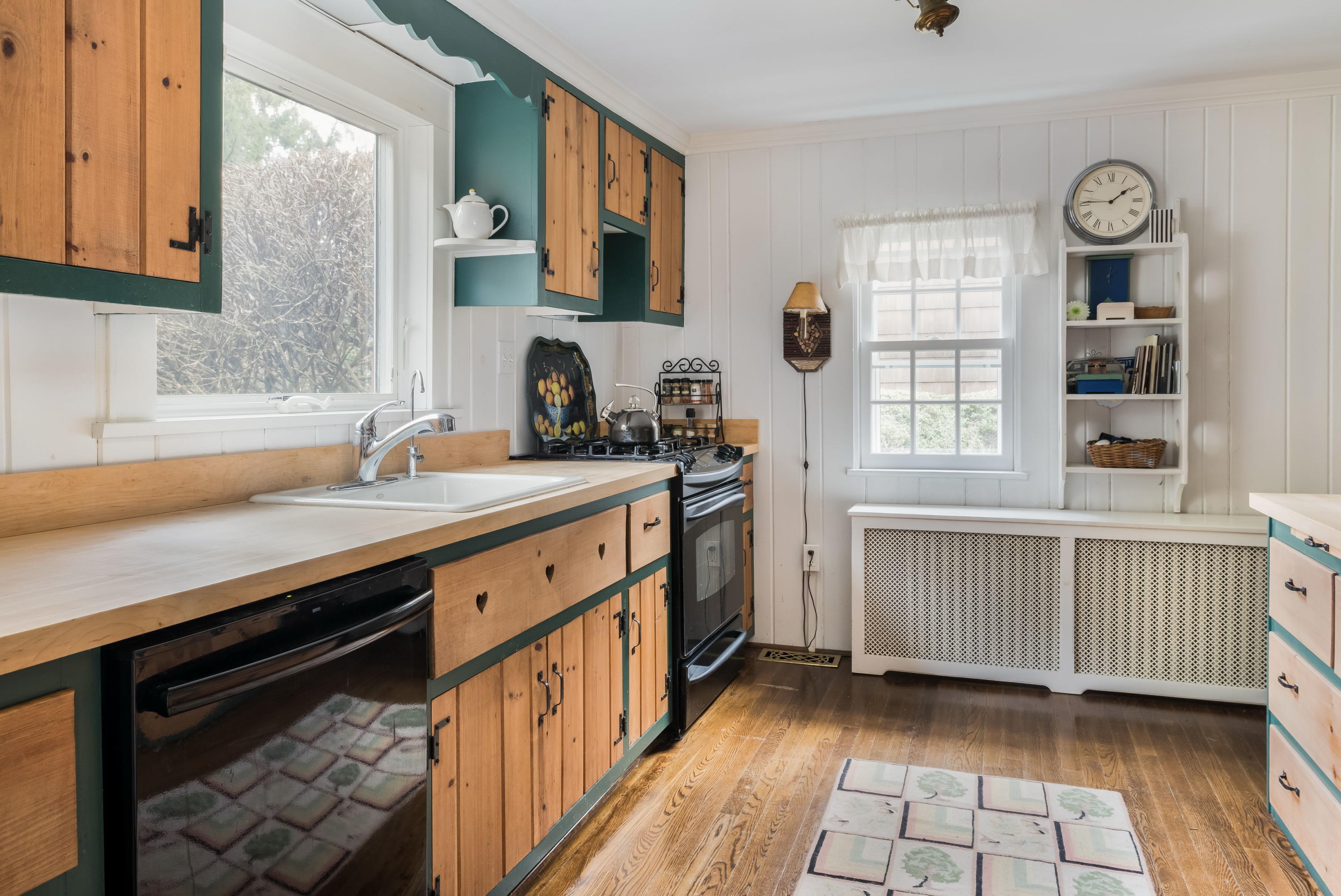 258 Hollow Tree Ridge Road Darien, CT 06820 - Photo 11 of 28 a kitchen with a sink stove and cabinets