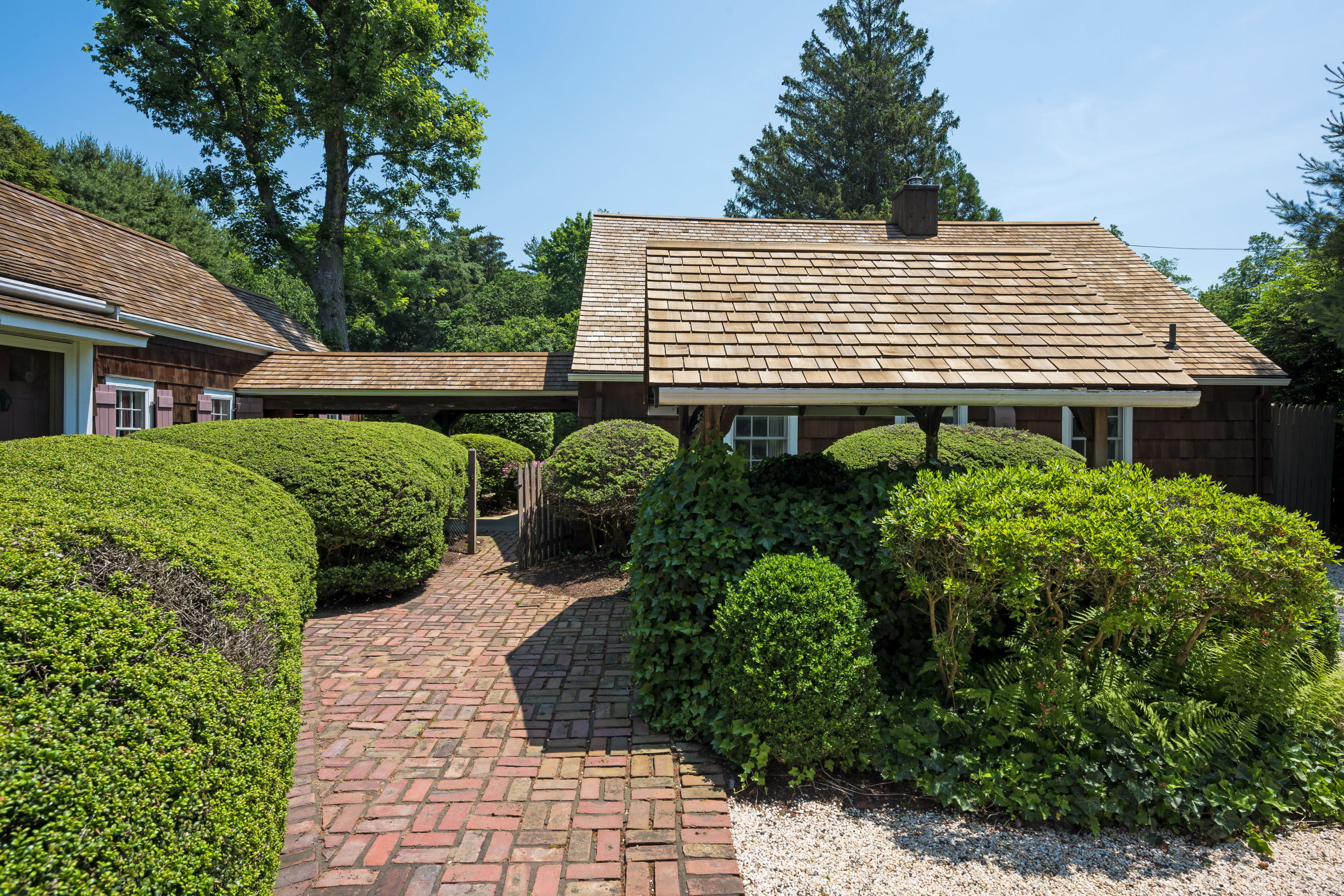 258 Hollow Tree Ridge Road Darien, CT 06820 - Photo 20 of 28 a front view of a house with a yard