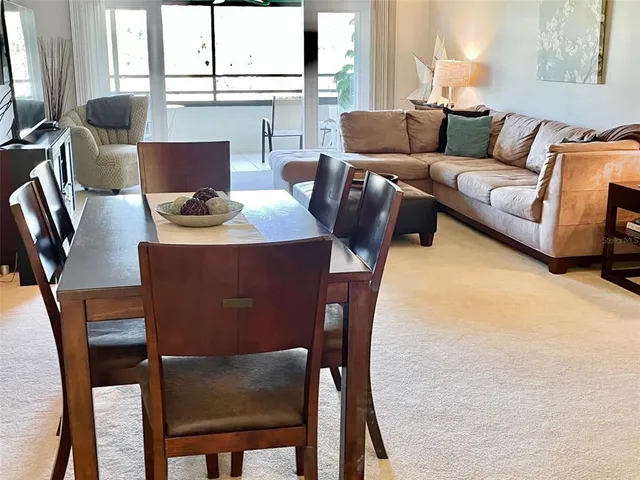 a view of a dining room with furniture window and outside view