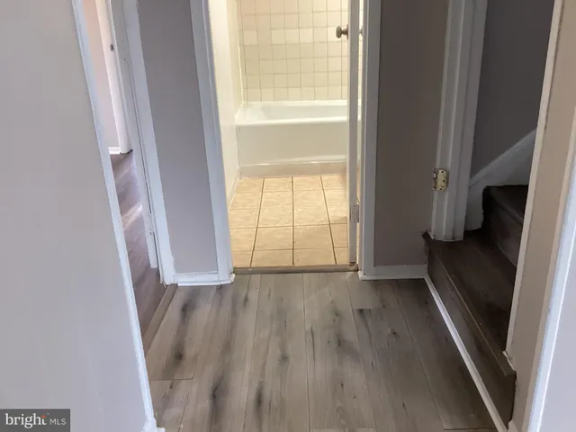 a view of an empty room and a window