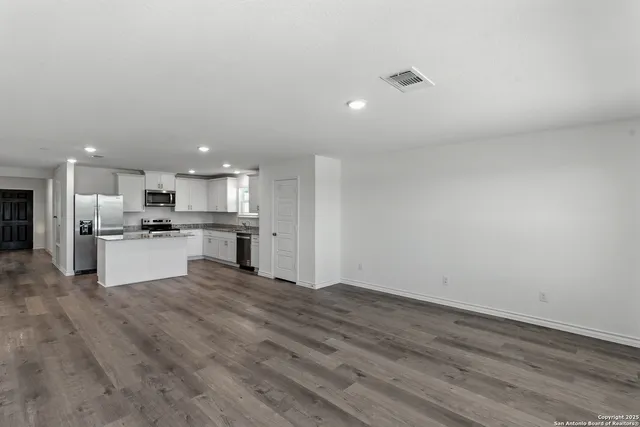 a view of kitchen with wooden floor