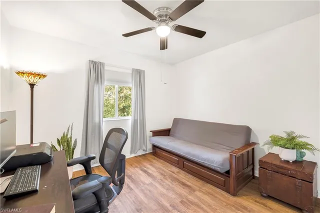 a living room with furniture and a window