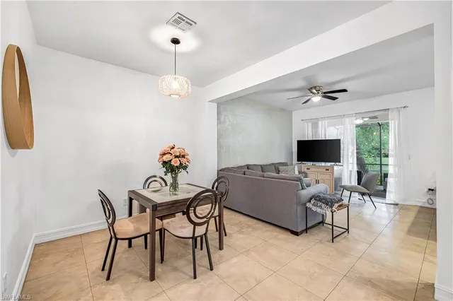 a view of a livingroom with furniture and a window