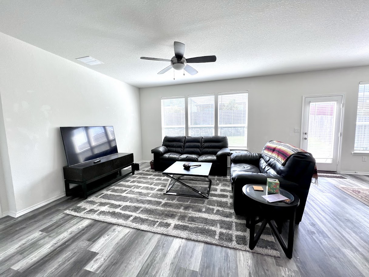 7900 Crystalbrook West Austin, TX 78724 - Photo 21 of 27 a living room with furniture and a flat screen tv
