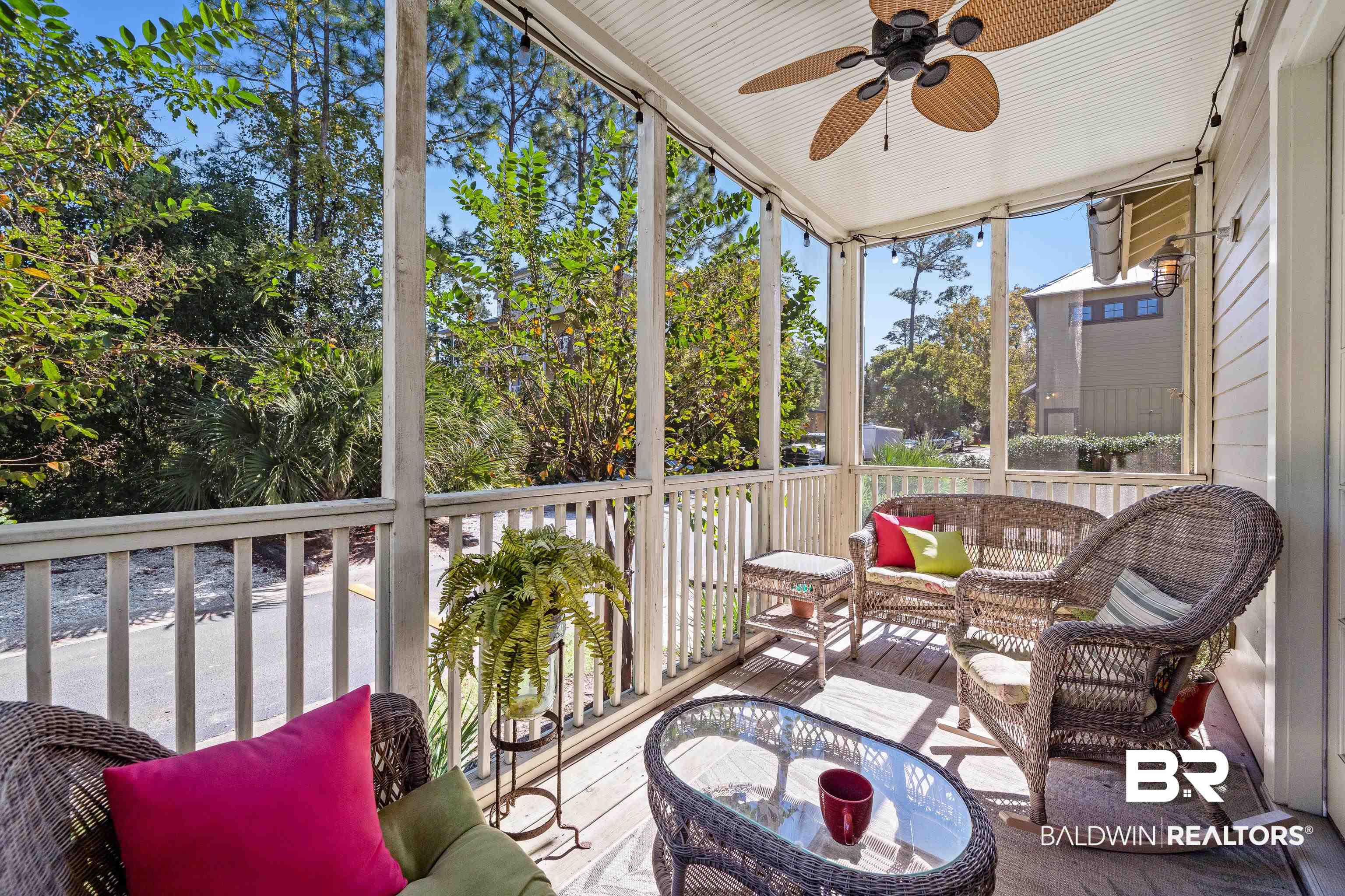 25773 Canal Road, Unit 10 Orange Beach, AL 36561 - Photo 15 of 40 Screened porch with ceiling fan and a healthy amount of sunlight