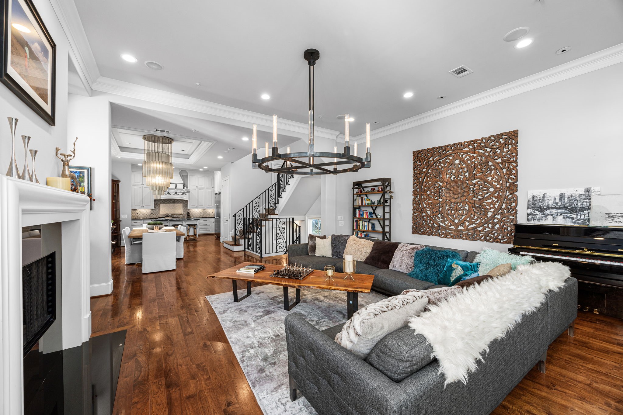 1723 Sunset Boulevard Houston, TX 77005 - Photo 11 of 50 The open-concept design creates a natural connection between living and dining areas, perfect for entertaining while maintaining an airy, elegant feel.