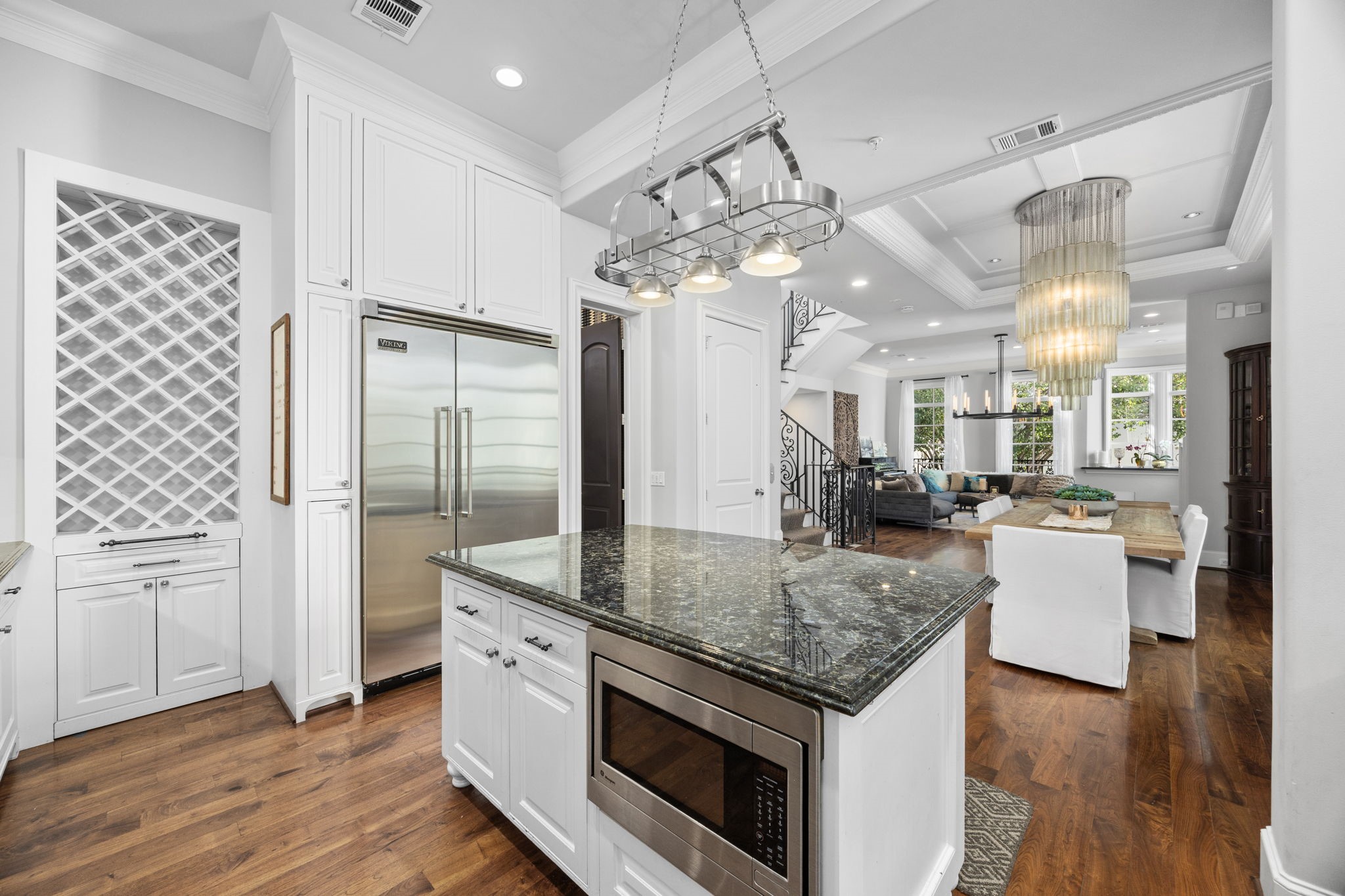 1723 Sunset Boulevard Houston, TX 77005 - Photo 19 of 50 A wine storage feature conceals a hidden door that opens into a walk-in pantry.