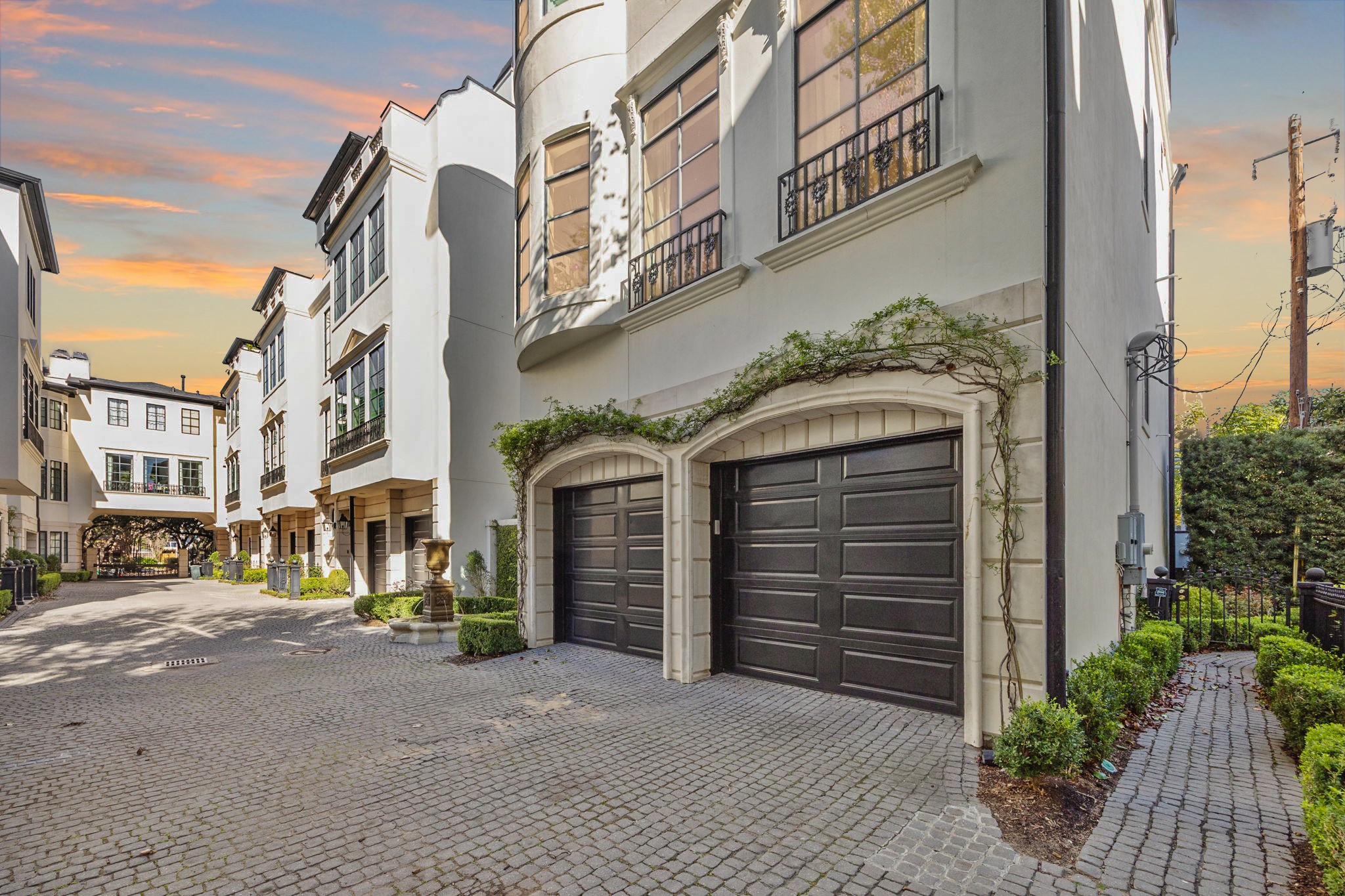 1723 Sunset Boulevard Houston, TX 77005 - Photo 2 of 50 An attached two-car garage with EV power and three adjacent guest parking spots offer secure off-street parking.