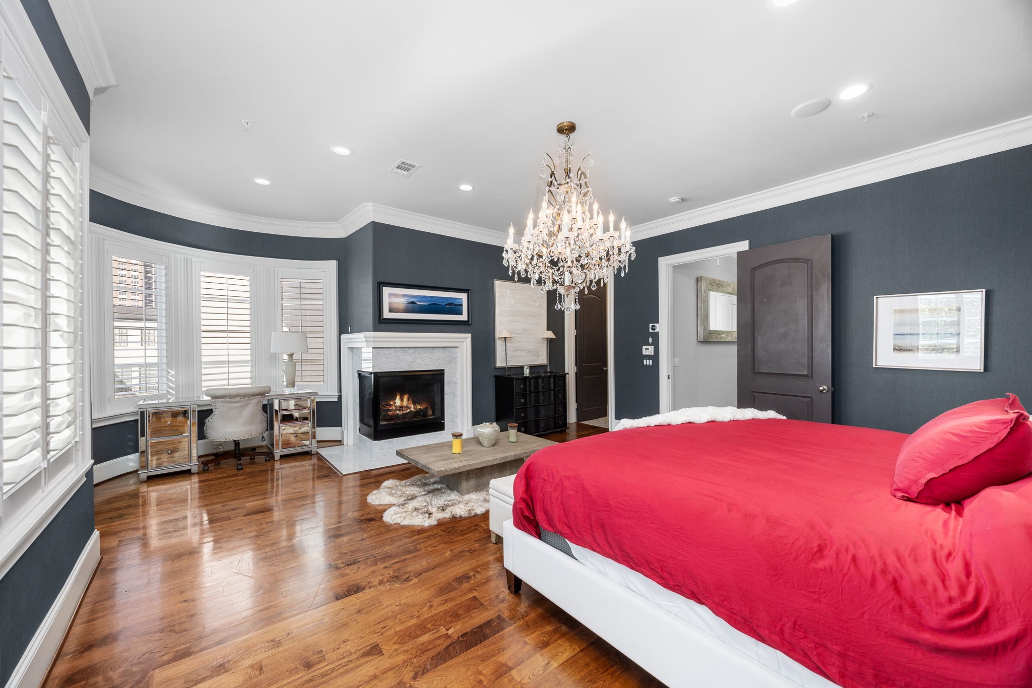 1723 Sunset Boulevard Houston, TX 77005 - Photo 23 of 50 A cozy fireplace anchors the primary suite, adding warmth and ambiance that elevates this space into a private sanctuary.