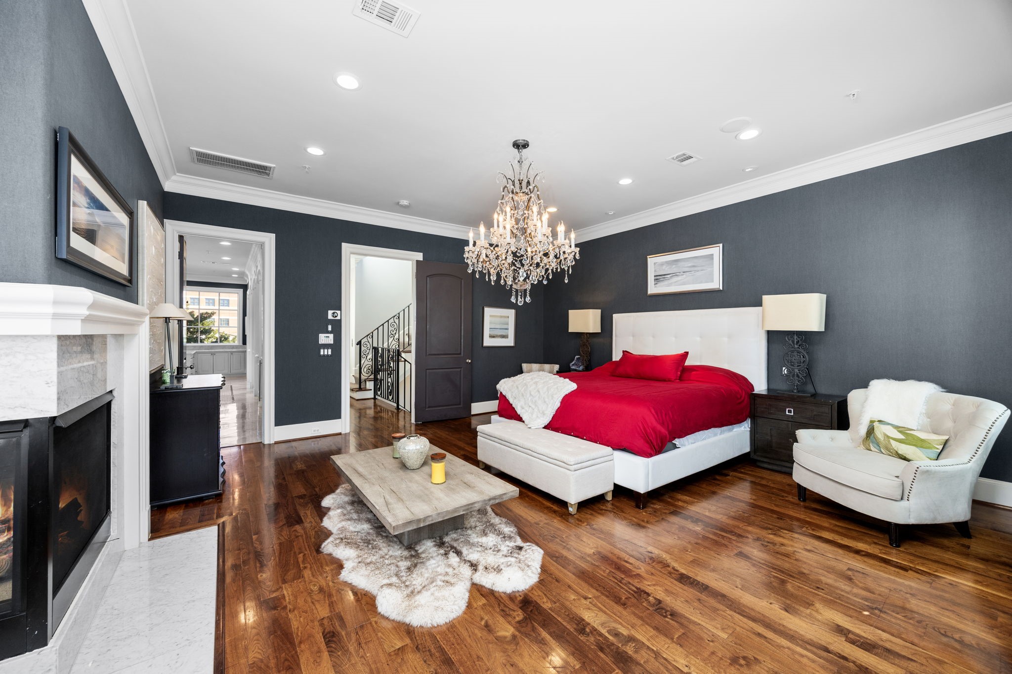1723 Sunset Boulevard Houston, TX 77005 - Photo 24 of 50 Expansive windows frame peaceful treetop scenery, filling the primary bedroom with natural light and a sense of privacy above the surrounding streetscape.