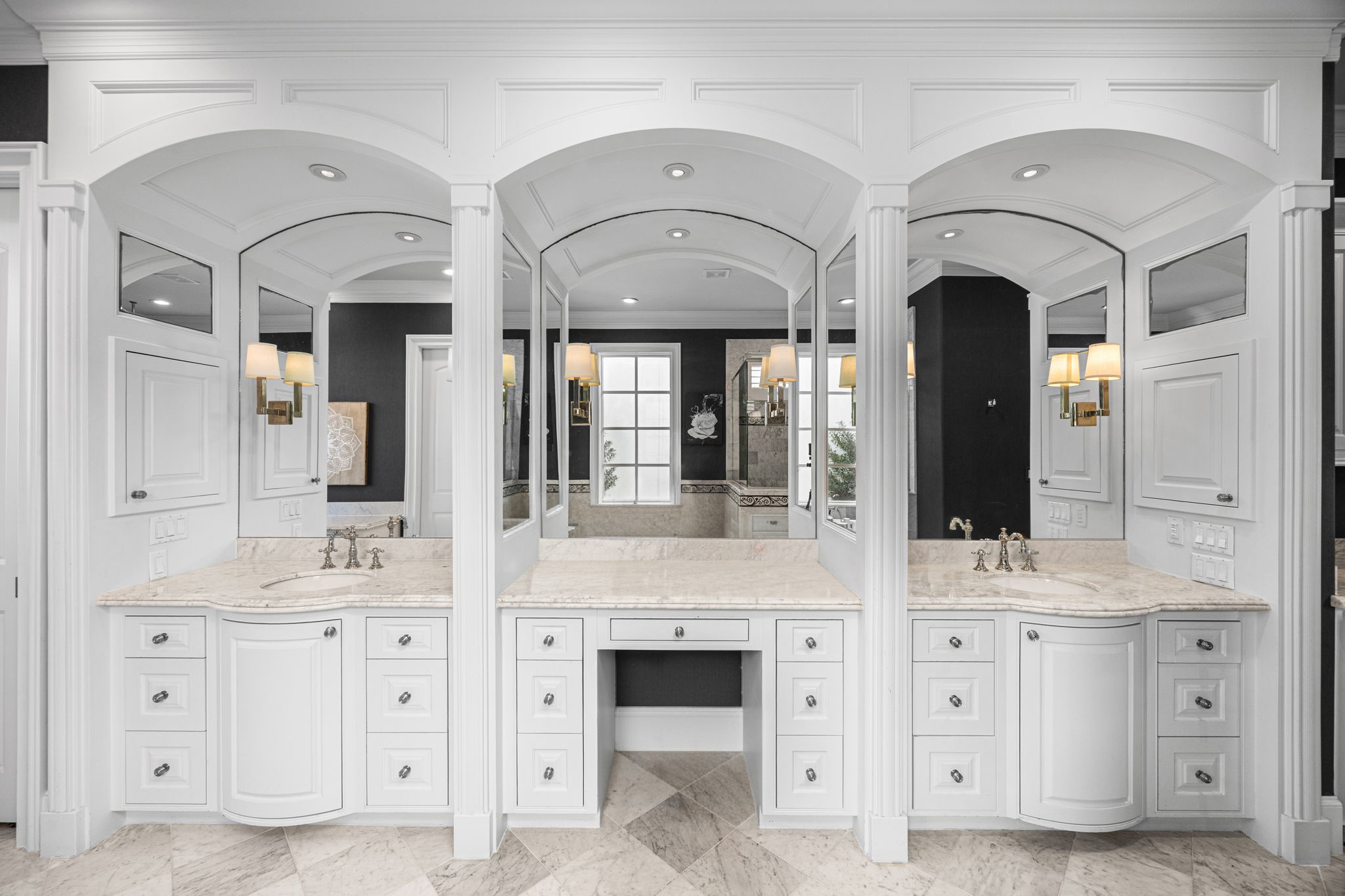 1723 Sunset Boulevard Houston, TX 77005 - Photo 28 of 50 Dual custom vanities provide abundant storage and symmetry, blending timeless design with thoughtful functionality.