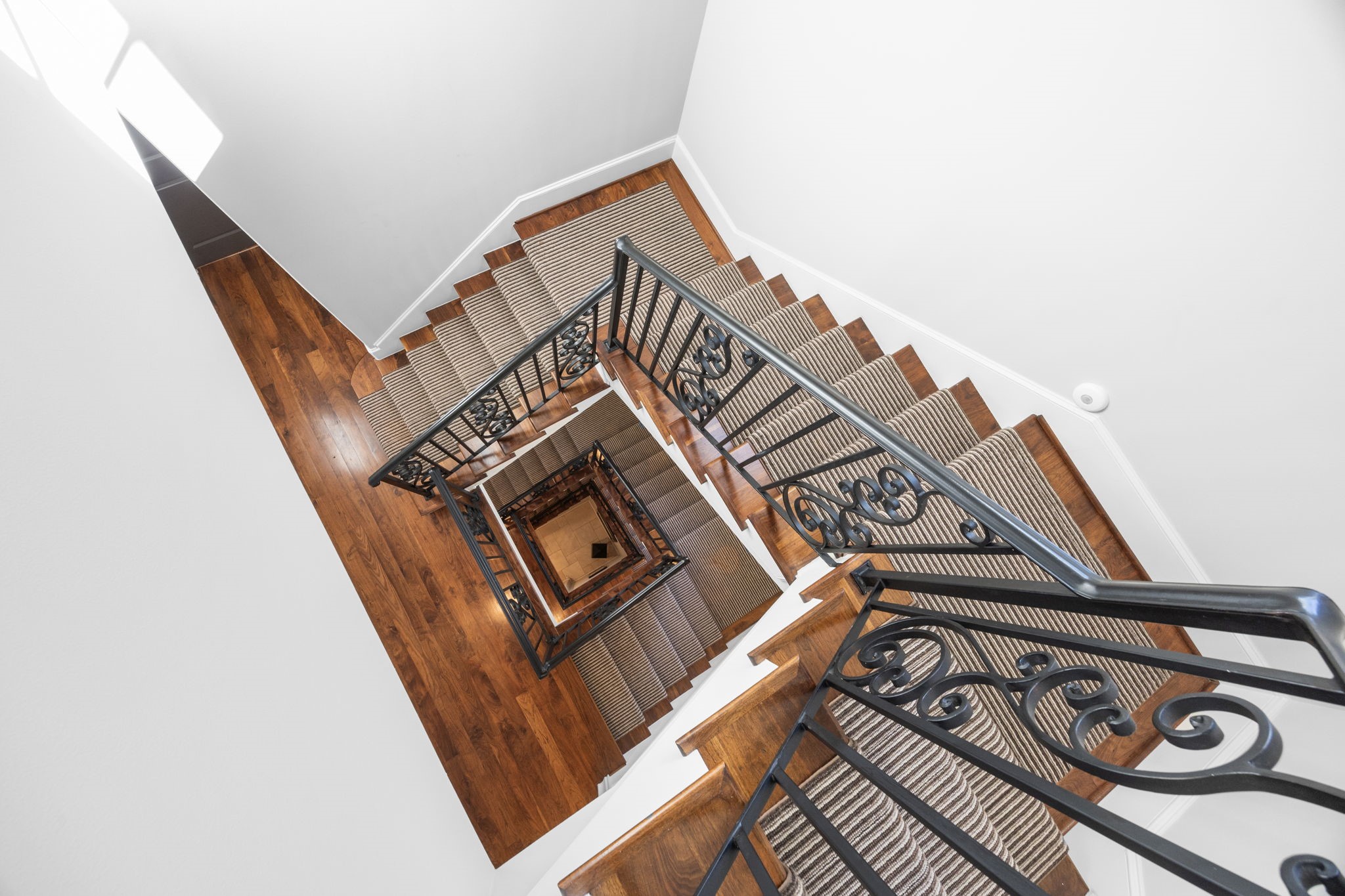 1723 Sunset Boulevard Houston, TX 77005 - Photo 33 of 50 Architectural sightlines and a dramatic staircase create visual interest while highlighting the home’s vertical design and refined craftsmanship.