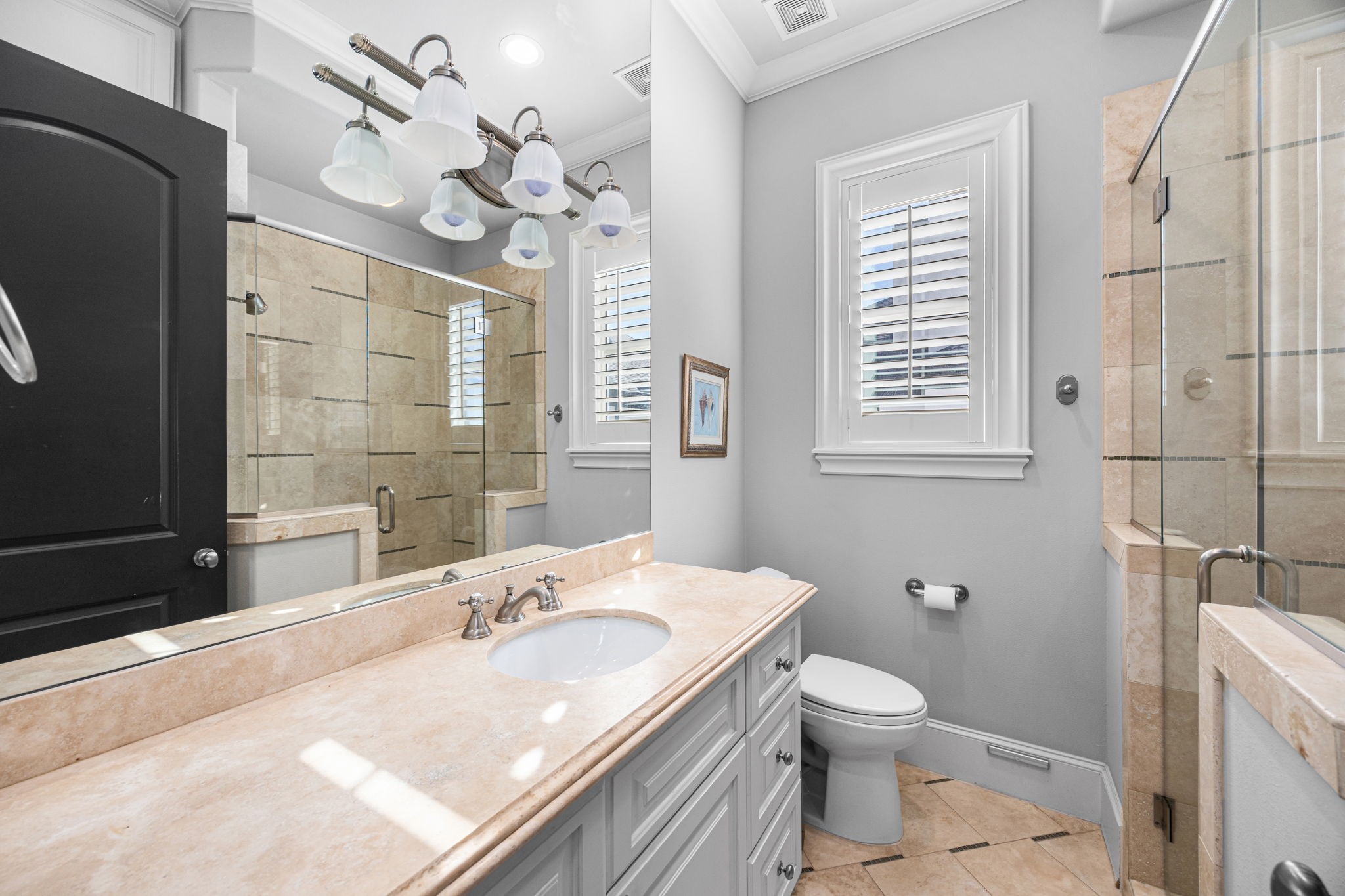 1723 Sunset Boulevard Houston, TX 77005 - Photo 39 of 50 The full bathroom on the top level is finished with classic tile, modern fixtures, a walk-in shower, and a clean, timeless design that complements the adjacent bedroom.