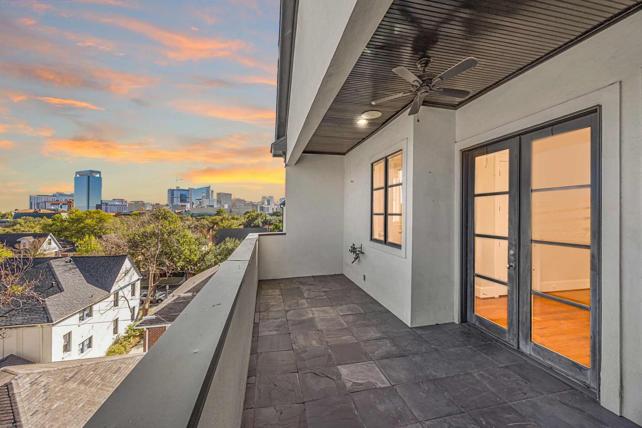 1723 Sunset Boulevard Houston, TX 77005 - Photo 41 of 50 From the balcony, enjoy elevated perspectives of the surrounding neighborhood and the Med Center, offering a peaceful spot for evening sunsets.